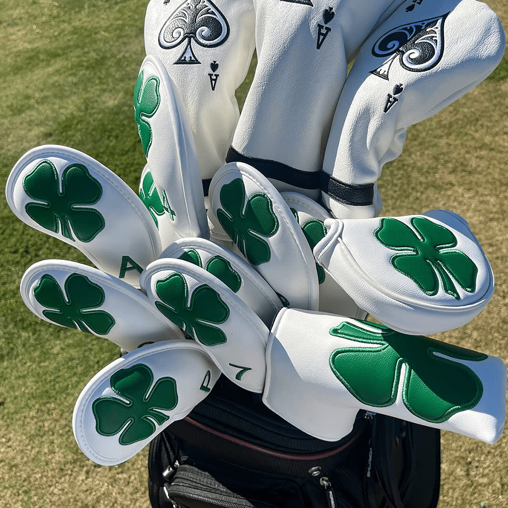 white leather lucky clover mallet putter covers sit in golf bags