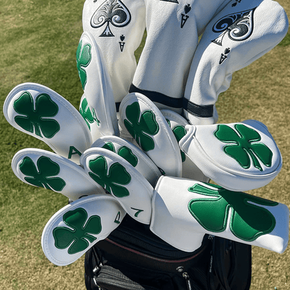 white leather lucky clover mallet putter covers sit in golf bags