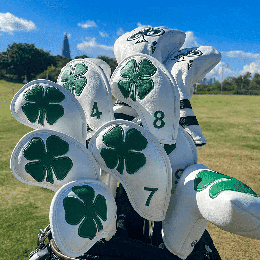 White Luck of the Irish irons head covers in golf bags